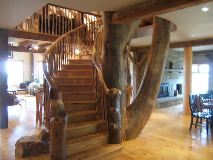 Fabulous live edge stairs and central column in unique timber frame home
