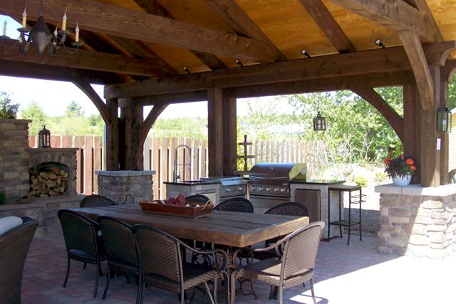 Showing the lasrge dining area of the Timber Frame Outdoor Kitchen