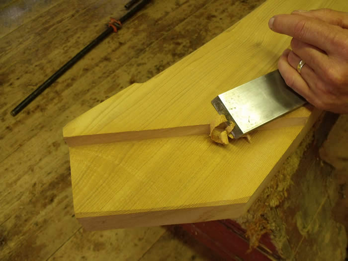 Chiseling a brace - Timber Frame Glossart