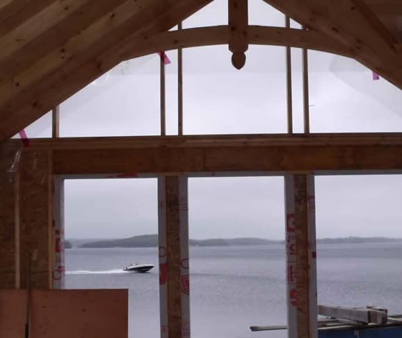 Timber Frame Great room with a view of the water